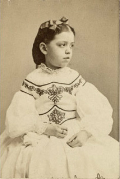 Amy Hewitt as a young girl